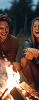 Joyous group of millennials laughing and bonding around a campfire, embodying friendship and fun during a wilderness camping adventure, generative ai